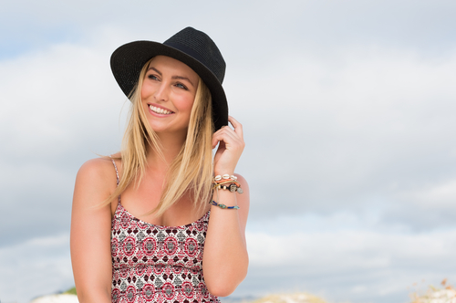 Young woman enjoying the beach after LASIK