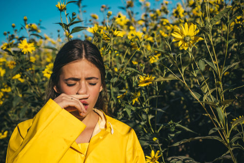 Young woman suffering from allergies