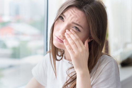 Woman suffering from dry eyes